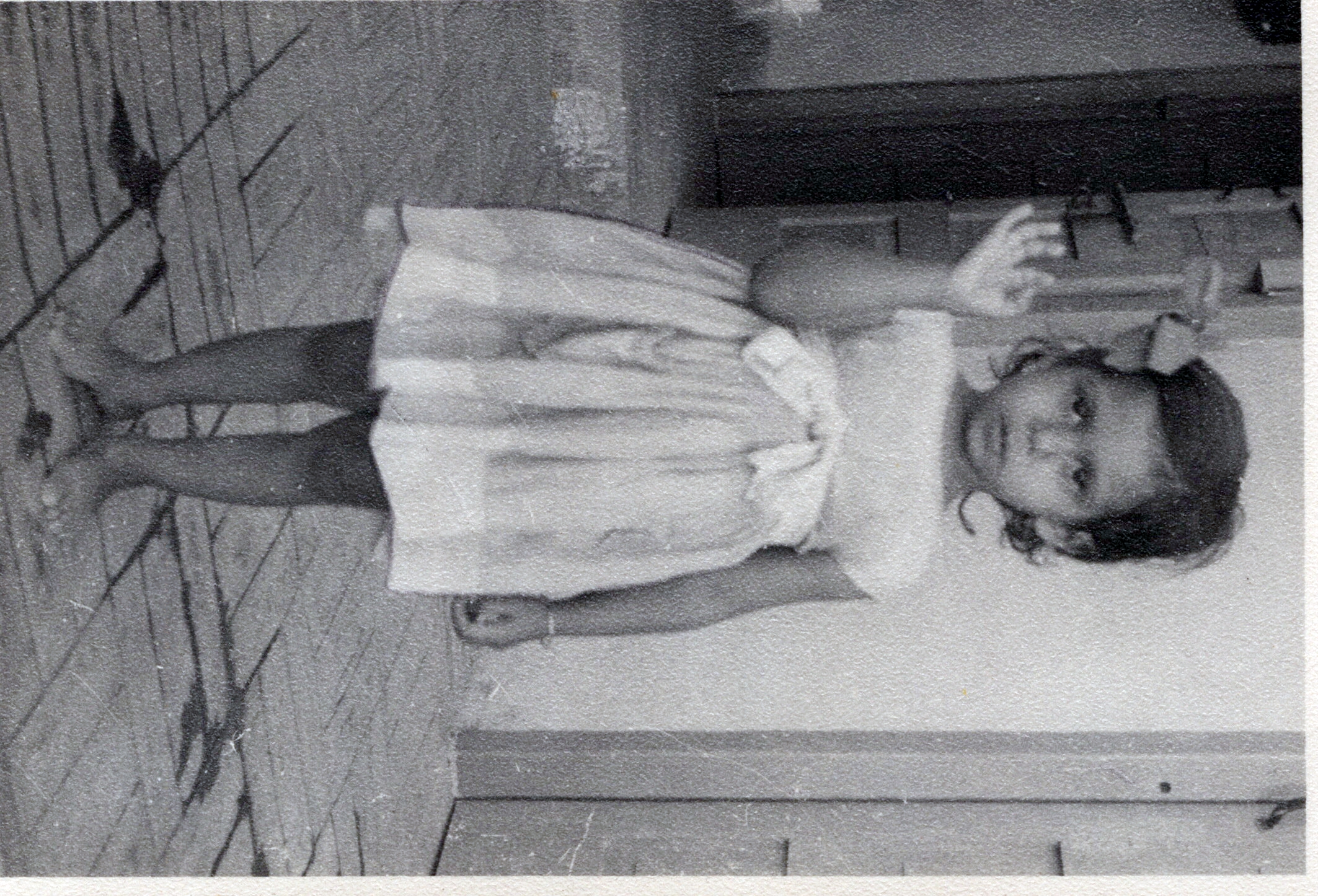 Black and white archive photograph of Himmat Singh Shinhat as a young child in Agra, India, circa early 1960s, dressed in fluid clothing sewn by his mother — from the family archive of Harchand Singh Shinhat